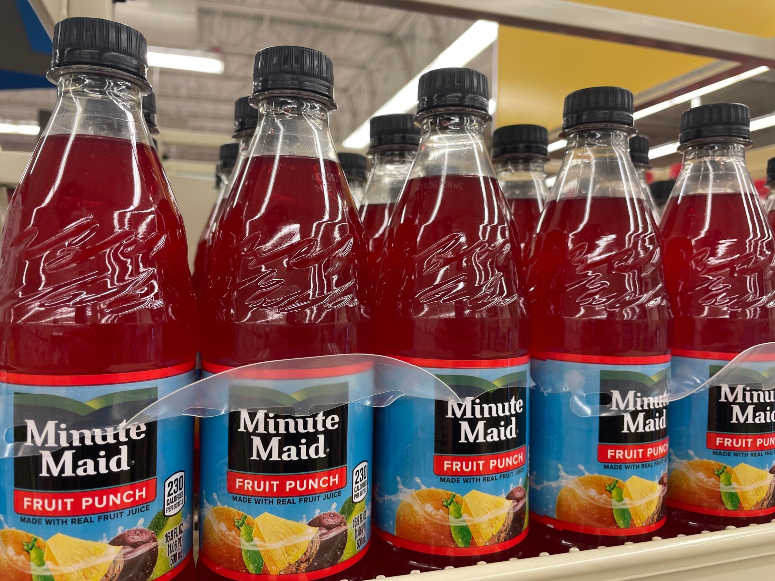 Minute Maid drink bottles on a grocery shelf. 