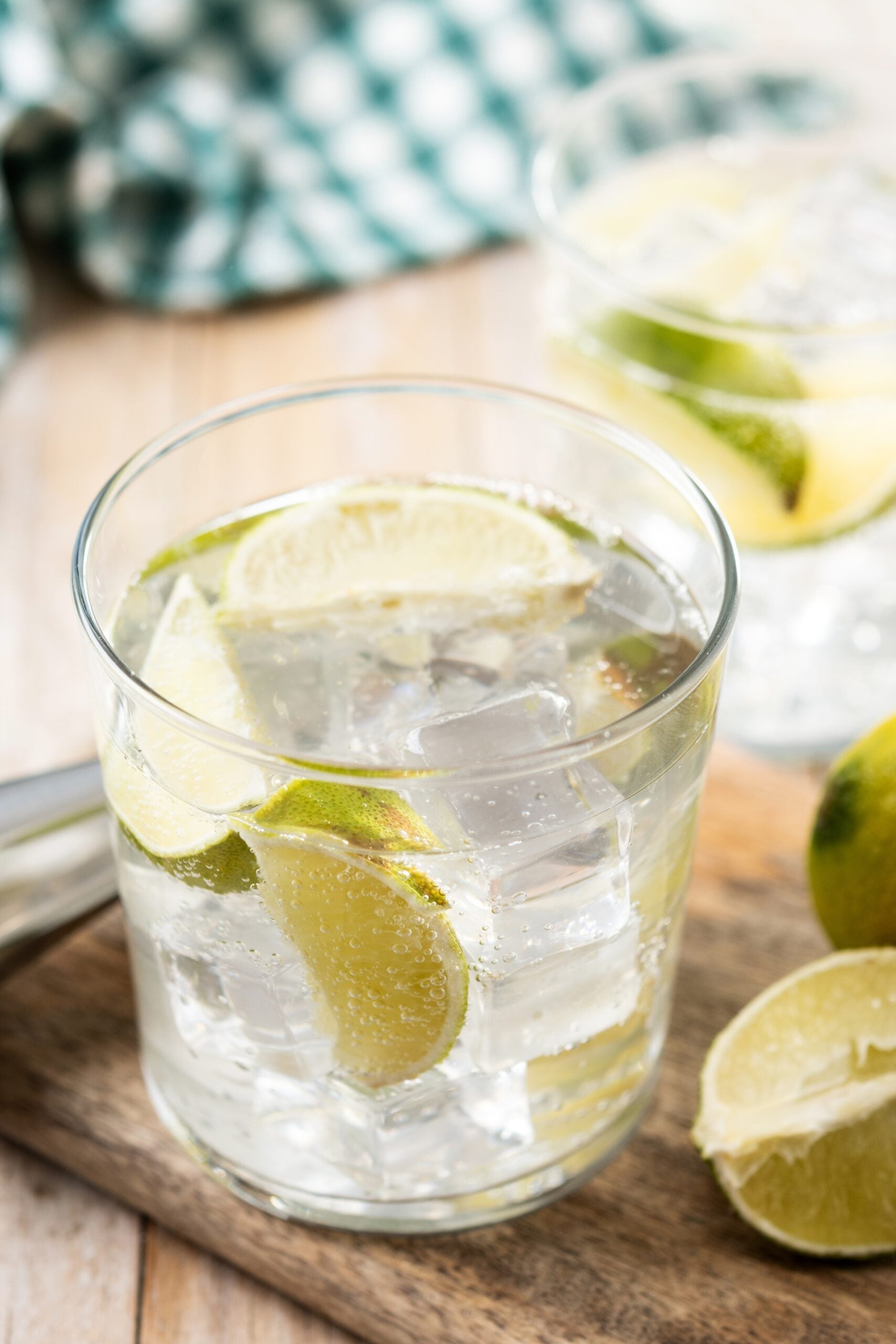 A zoom-in picture of a refreshing vodka tonic with lemon. 