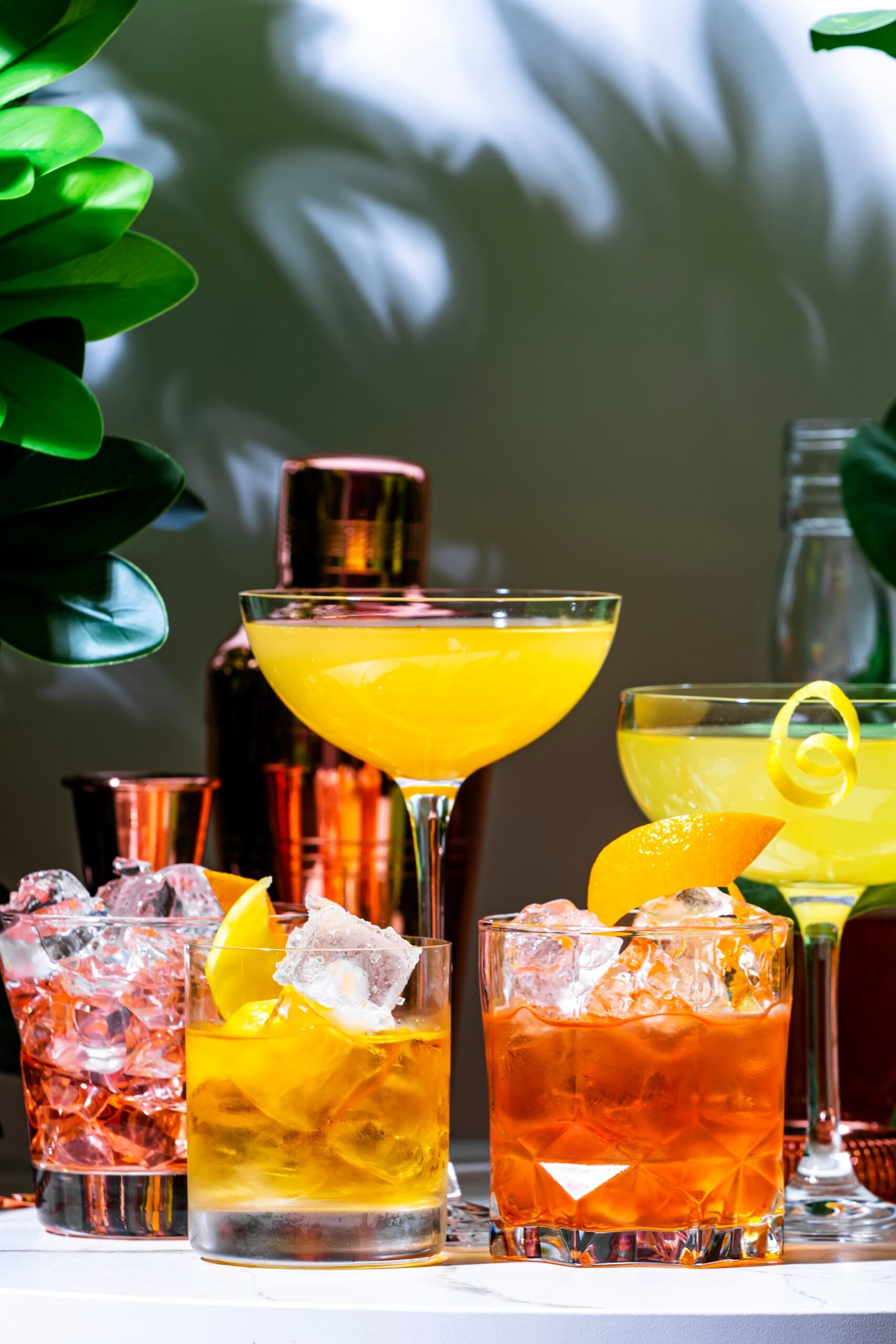 Assorted upside-down cocktails on a marble table. 