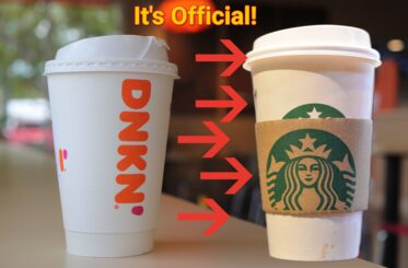Starbucks cup with arrows pointing to it vs. a Dunkin' cup. The words "It's Official"