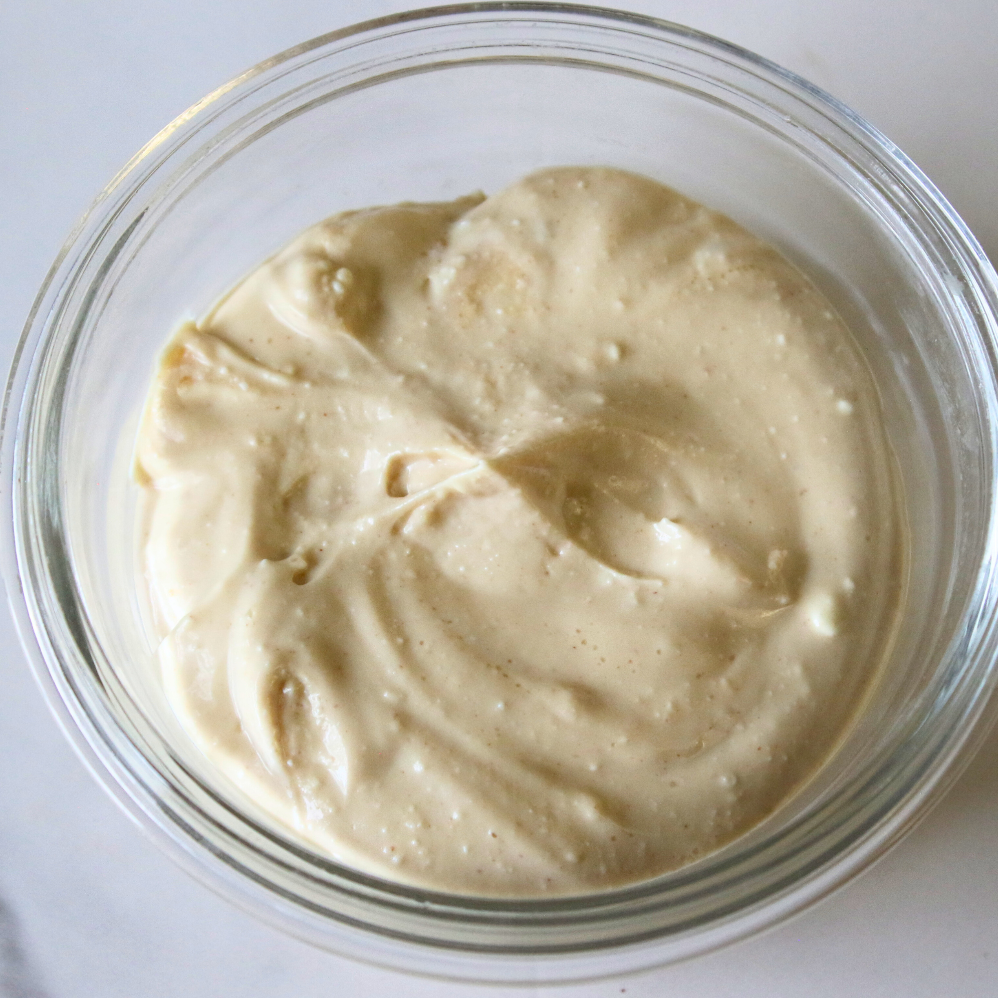 A creamy pudding in a glass bowl.