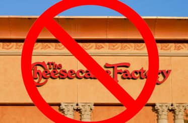 The Cheesecake Factory sign with a big red "cancel" symbol over it