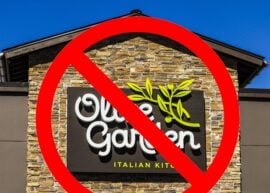 Olive Garden restaurant sign with a "no" sign over it.
