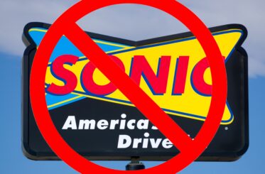Sonic America's Drive-In sign with a "no" sign over it
