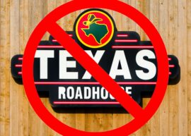 Texas Roadhouse sign with a "no" sign over it.