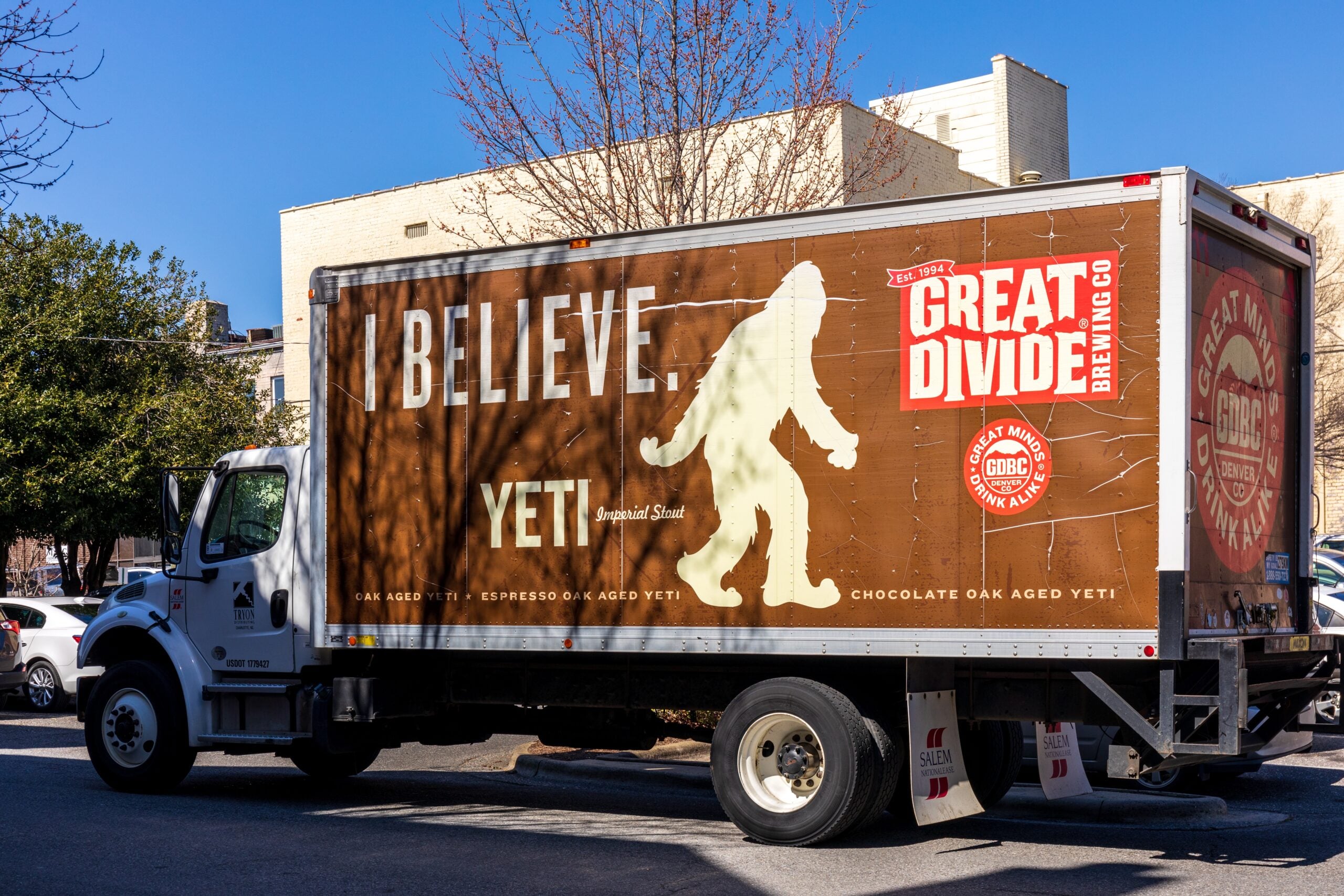 A straight truck with Yeti Imperial Stout's advertisement on the side .