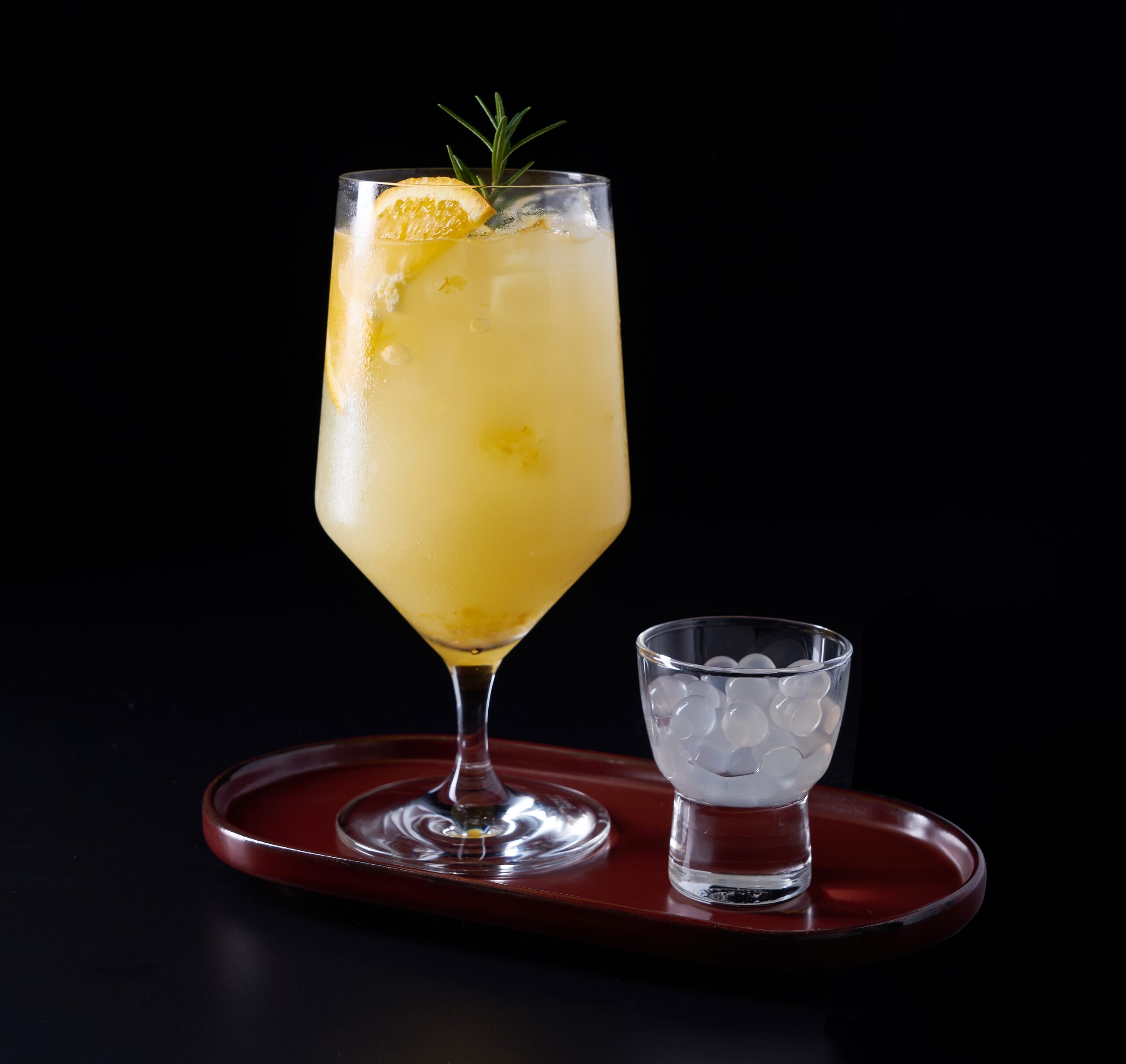 A refreshing yuzu juice on a black background.