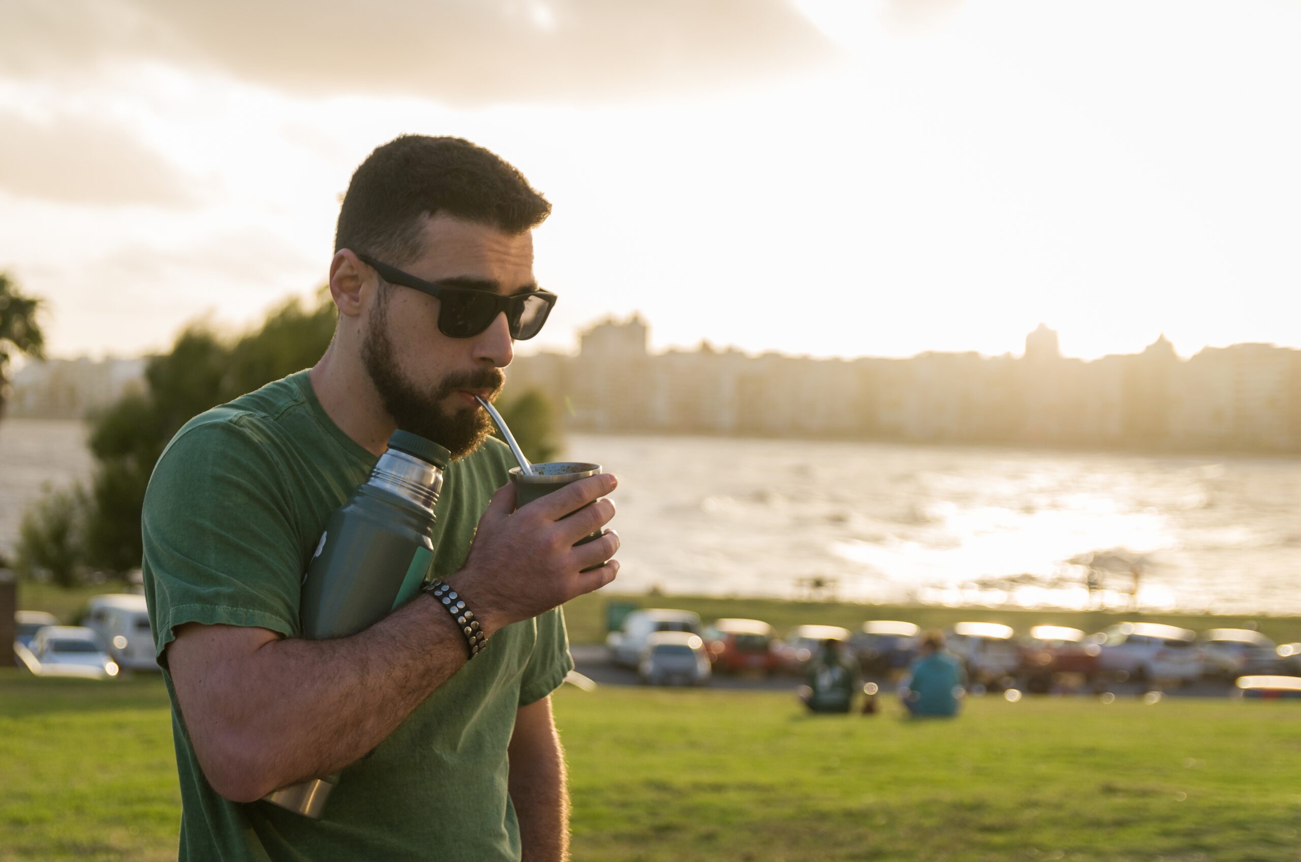 A young man drinking mate, prepared with yerba mate.