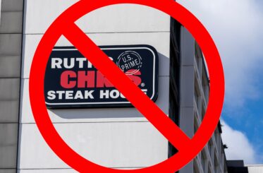 Ruth's Chris Steak House sign with a big red "cancel" symbol over it