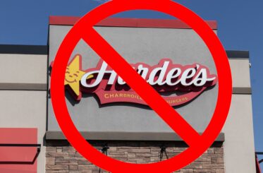 Hardee's sign with a big red cancel symbol over it