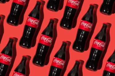 Coca-Cola bottles on a red background