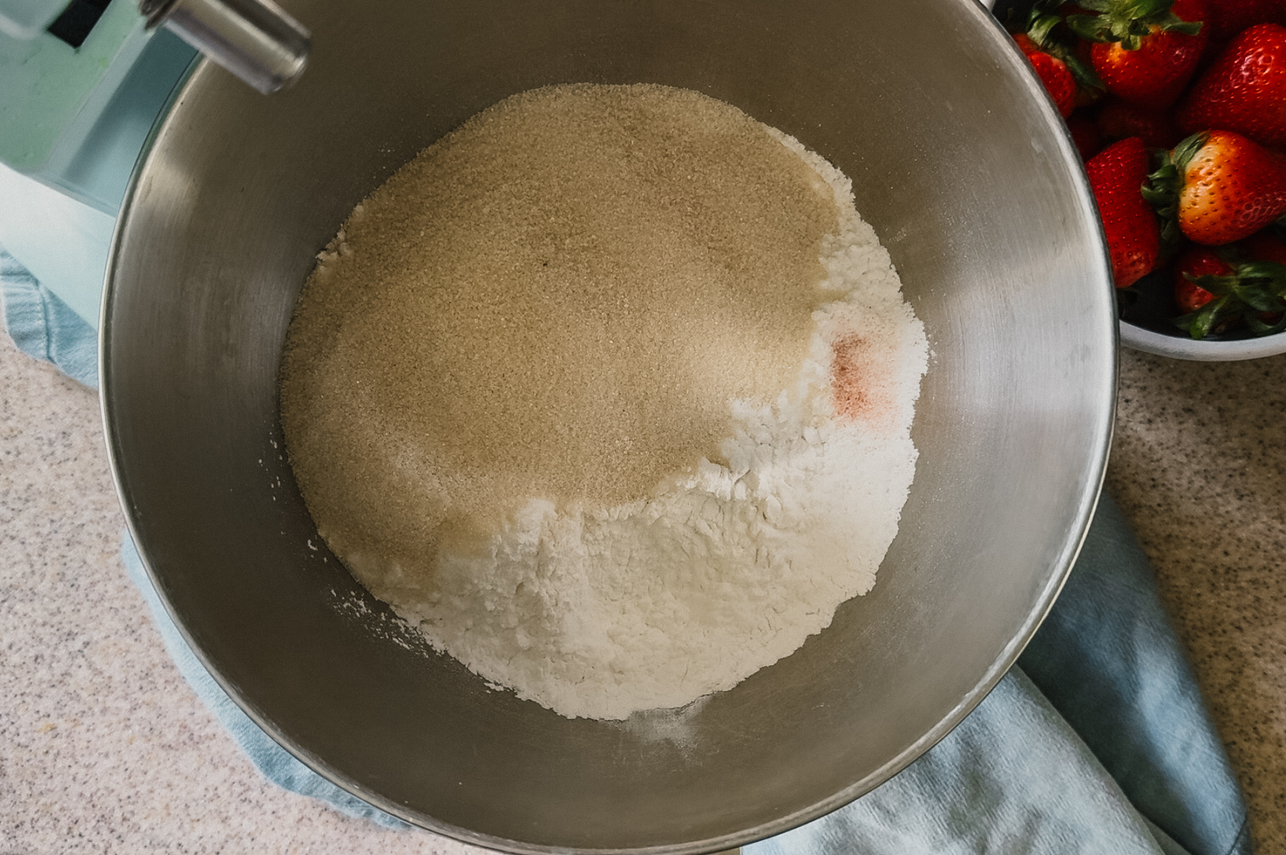 A mixer bowl full of ingredients.
