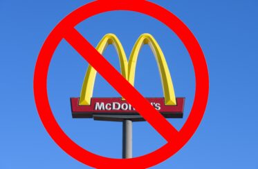 McDonald's sign with a big red "cancel" symbol over it