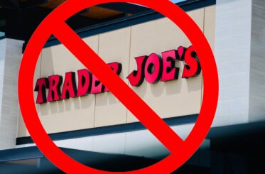 Trader Joe's sign with a big red "cancel" symbol over it