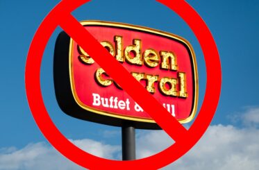Golden Corral sign with a big red "cancel" symbol over it