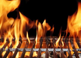 Flames shooting through a grill