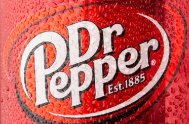 Close-up of Dr Pepper logo on a wet can