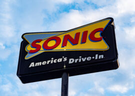 Sonic Drive-In sign with blue sky background.