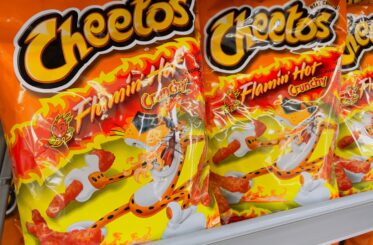 Bags of Cheetos Flamin' Hot Crunchy on shelf