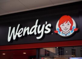 Wendy's logo with red-haired girl and text