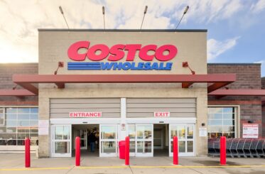 Costco store with entrance and exit signs