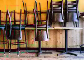 Chairs upside down on table in closed restaurant