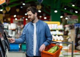 Man in self-checkout line