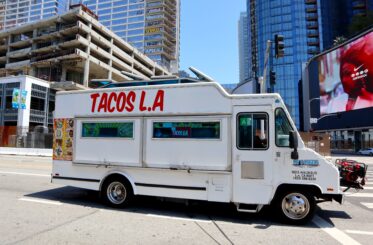 Taco truck that says "Tacos LA" on the side