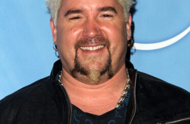 Guy Fieri smiling at the camera