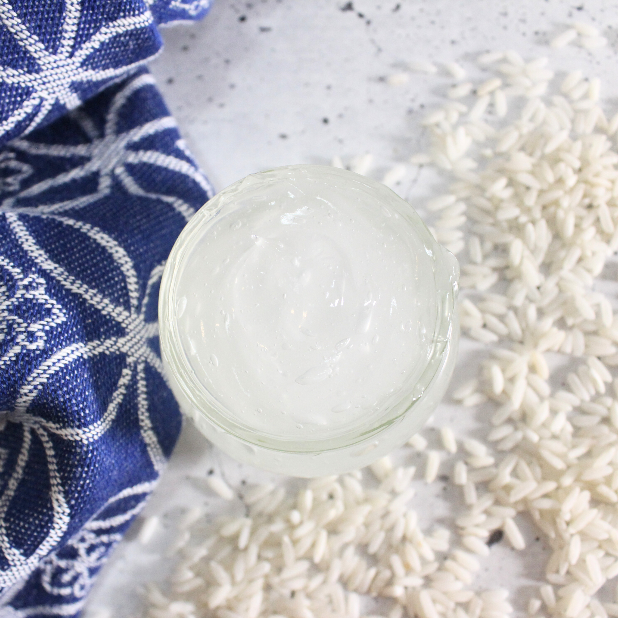 Homemade rice water hair mask in a glass jar.