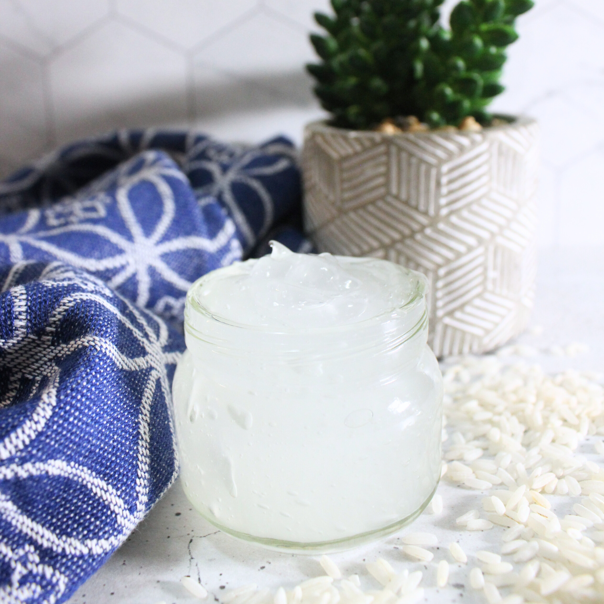 Homemade rice water hair mask in a glass jar.