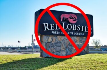 Red Lobster sign company business exterior with red not permitted sign over it.
