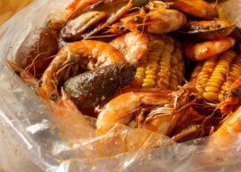 Close up of seafood boil with shrimp, potatoes, and corn
