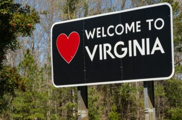 A highway sign welcomes drivers to the US commonwealth of Virginia.