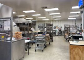industrial kitchen, interior of an industrial bakery, machinery and racks of a bakery