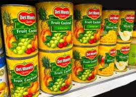 Del Monte brand canned fruit on grocery store shelves, variety of fruits and flavors. Smart and Final grocery store, aluminum cans, aluminum cans tariffs