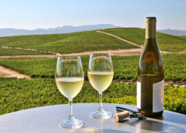 two glasses of white wine overlooking napa valley