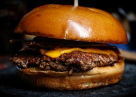 Mouth-watering close-up of a cheeseburger with bacon, ideal for food photography.