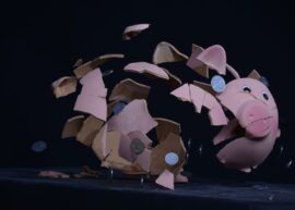 High-speed capture of a piggy bank shattering with coins scattering in mid-air.